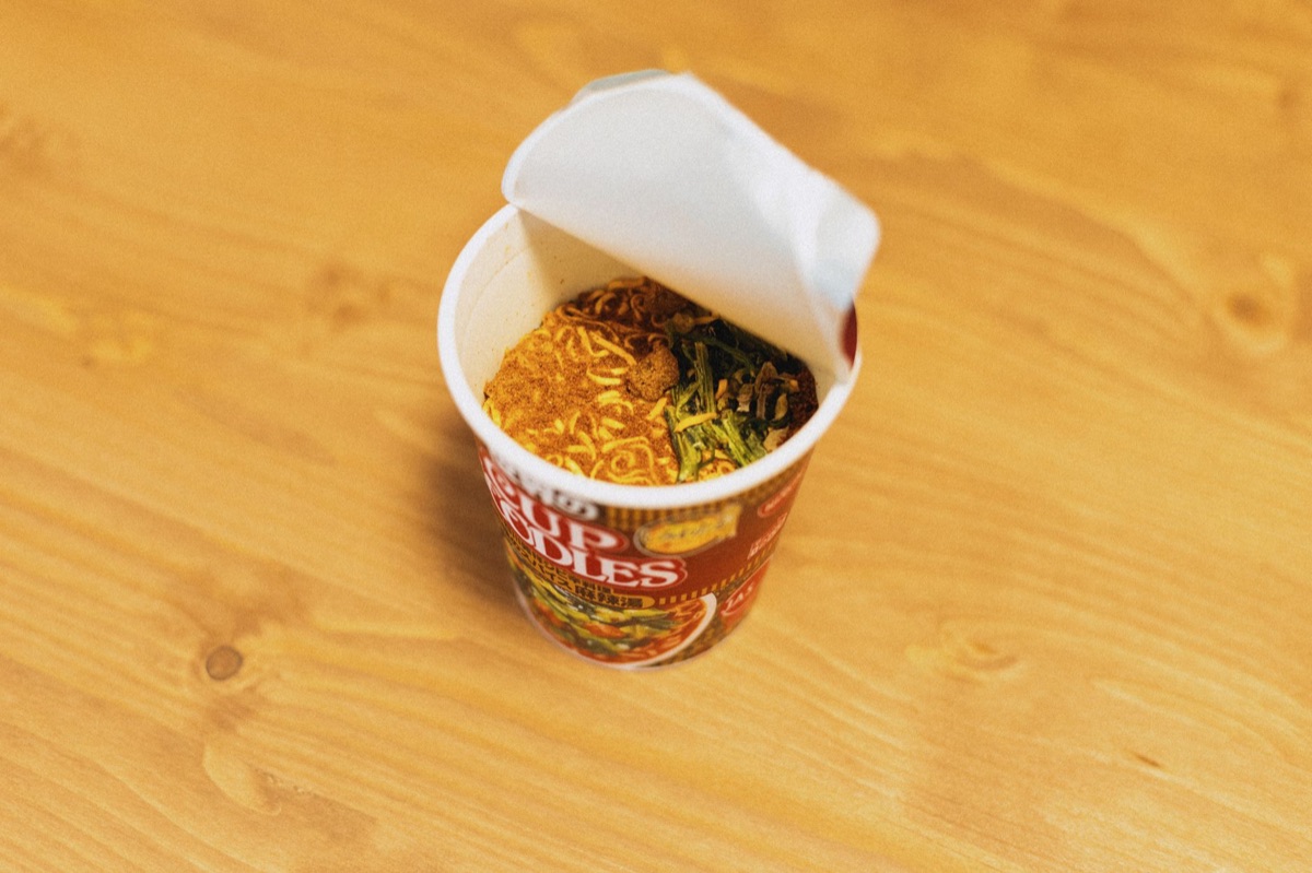 Shelves filled with instant ramen in a Japanese convenience store
